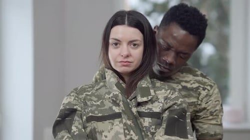 Loving Couple Embrace Wearing Camouflage