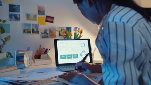 asia business lady freelance focus on laptop write worksheet finance graph account chart market plan