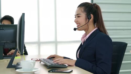 Business People Wearing Headset Working in Office