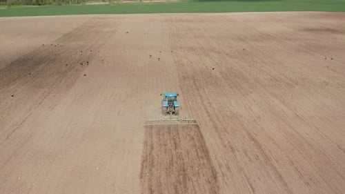 Tractor Plowing the Farm Field