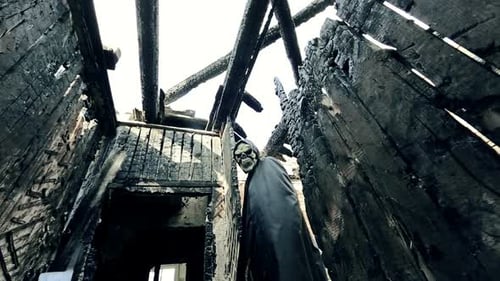 Sinister Figure in Fire Ravaged Building