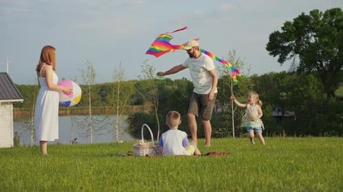Family Kite Flying Picnic in the Park
