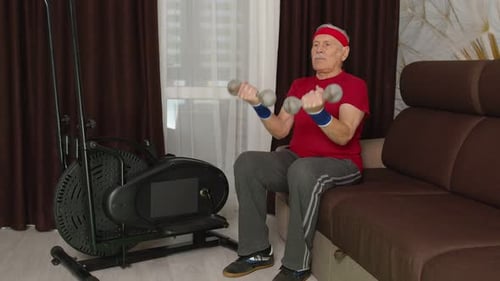 Senior Man Lifting Dumbbells at Home