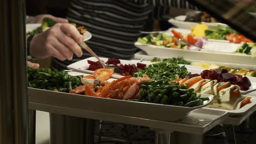 Buffet Table at the Restaurant. Hot and Fresh Food at a Mall Food Court. Self Service Meals. Cut