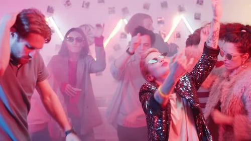 Fancy Woman Dancing with Friends at Home Party