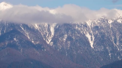 Timelapse Clouds Swirl in the Mountains