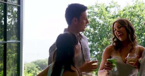 Group of friends enjoying drinks at restaurant