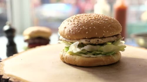 Close Up of Delicious Burger on Wood Slab