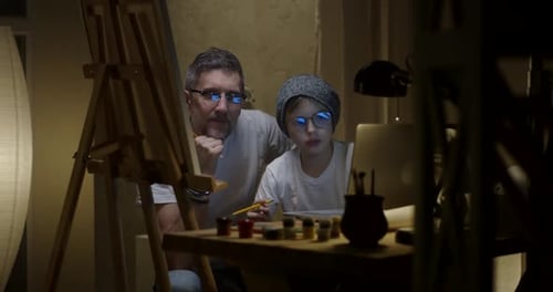 Artist and Son Painting Together