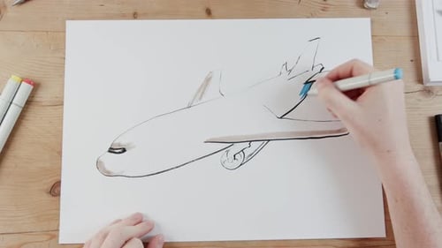 Zeitraffer eines Künstlers, der ein fliegendes Flugzeug zeichnet