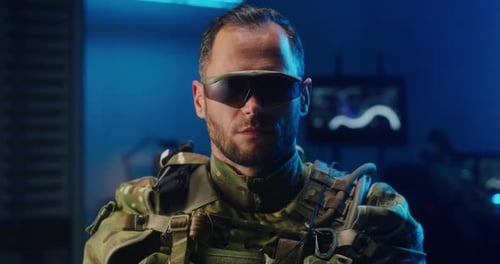 Man in Military Gear, Looking at Camera