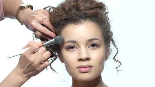Model Receiving Makeup Application Close Up