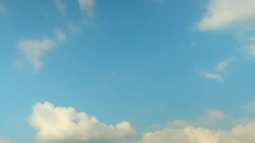 Clouds Drifting Across Blue Sky