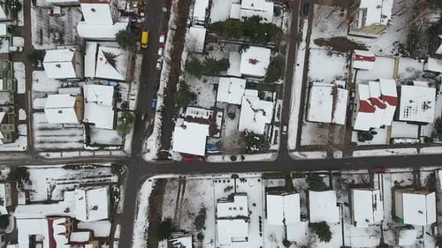 Flying Above Town Covered With Snow In Winter