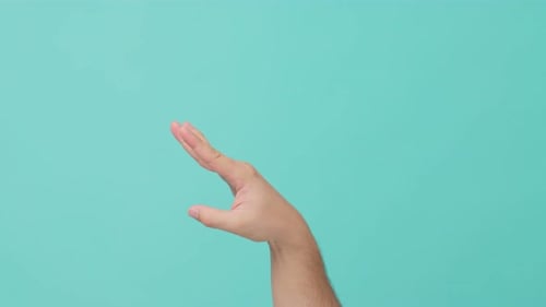 Close up shot of human hand raising stretch out hand flicking off in isolate blue screen.