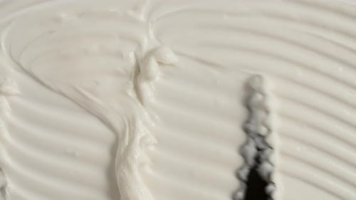 Spreading Creamy White Substance with Spatula, Close Up