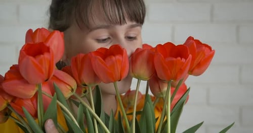 Child Smelling Bouquet of Tulips, Happy Birthday
