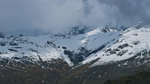 Stormy clouds moving above mountains