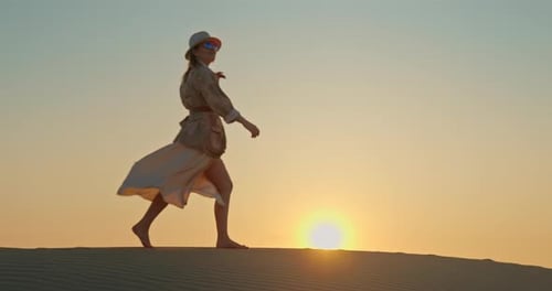 Attractive Lady Walking Barefoot on Sand in Desert During Safari