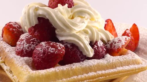 Delicious Waffle with Strawberries and Whipped Cream