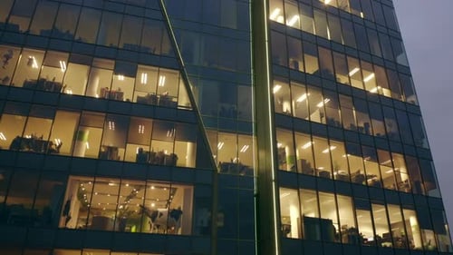 Aerial View of the Facade of an Office Building at Night