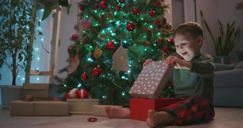 Boy Opens Christmas Present With Glowing Surprise