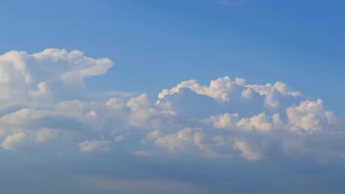Clouds Move and Swirl in the Blue Sky
