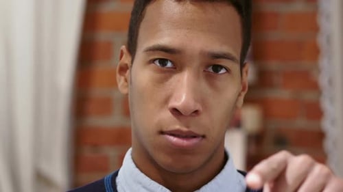 Angry Young Man Pointing, Looking Stern