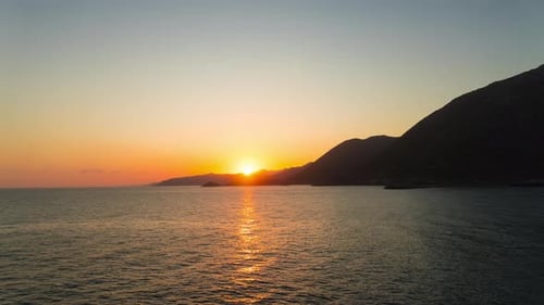 Time Lapse Sunrise over Sea and Mountain, Sunrise above Ocean, Beautiful Sun reflections on water