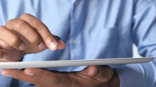 Man's Hand Working on Digital Tablet at Office Desk, Using Self Created Chart