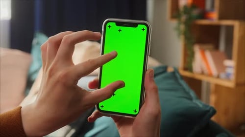 Closeup of Smartphone with Green Screen Young Man Hands Holding Mobile Phone Zoom in Isolate Display