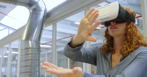 Young Woman Using VR Headset in Modern Office