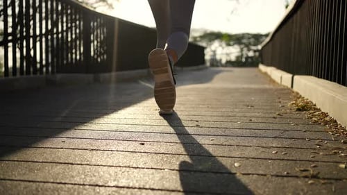 4K Asian woman jogging exercise at public park in the morning