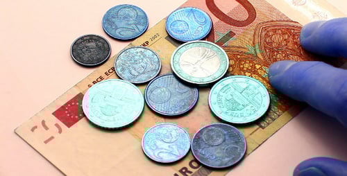 Euro Coins and Banknote on a Table