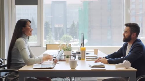 Office Meeting Ends With a Handshake