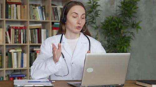 Woman Doctor Telehealth Consultation Using Laptop