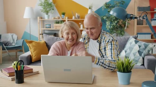 Senior Couple Enjoying Video Call on Laptop