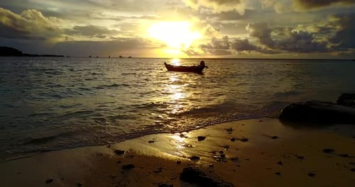 Wide angle aerial tourism shot of a paradise sunny white sand beach and blue water background