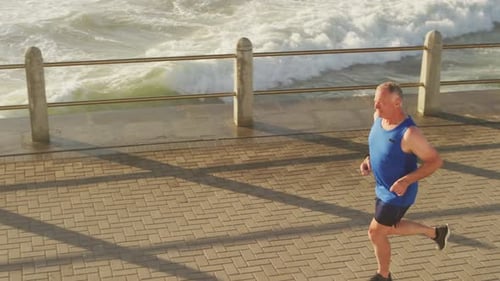 Senior man running on the promenade