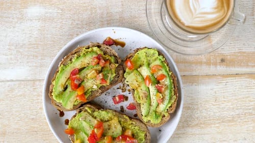 Healthy Breakfast in Cafe Top View of Fresh Avocado Toasts with Tomato