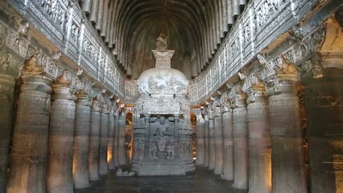 Long hall with columns and arcades inside of Aurangabad caves.