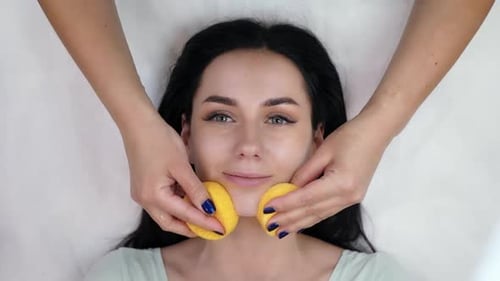 Woman Receiving Facial with Sponges Close Up