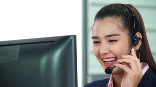 Business People Wearing Headset Working in Office