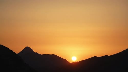 Mountain Range Silhouetted at Sunset in Golden Hour