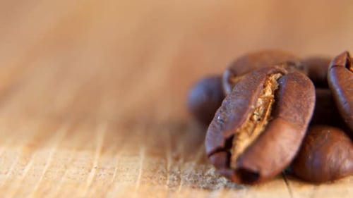 Close up of Roasted Coffee Beans on Wood