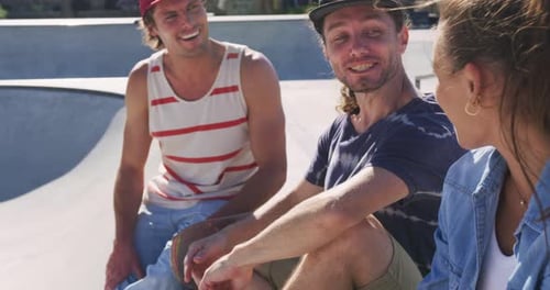Friends Talking and Laughing at a Skatepark