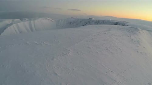 Fly Over Snow Covered Mountains In The Morning