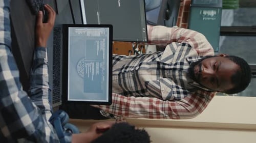 People Working at Desks in Urban Office