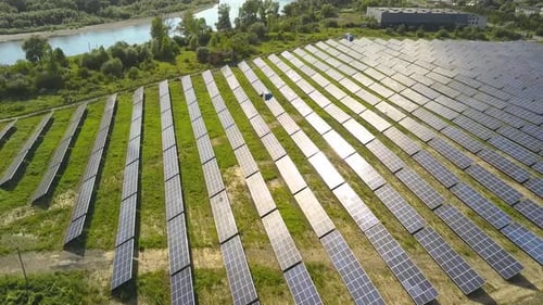 Aerial view of solar power plant field. Electrical photovoltaic panels for producing clean ecologic