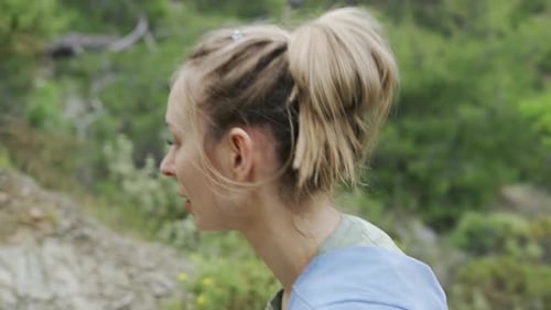A Woman Walking Up By Rocky Steps on a Hike